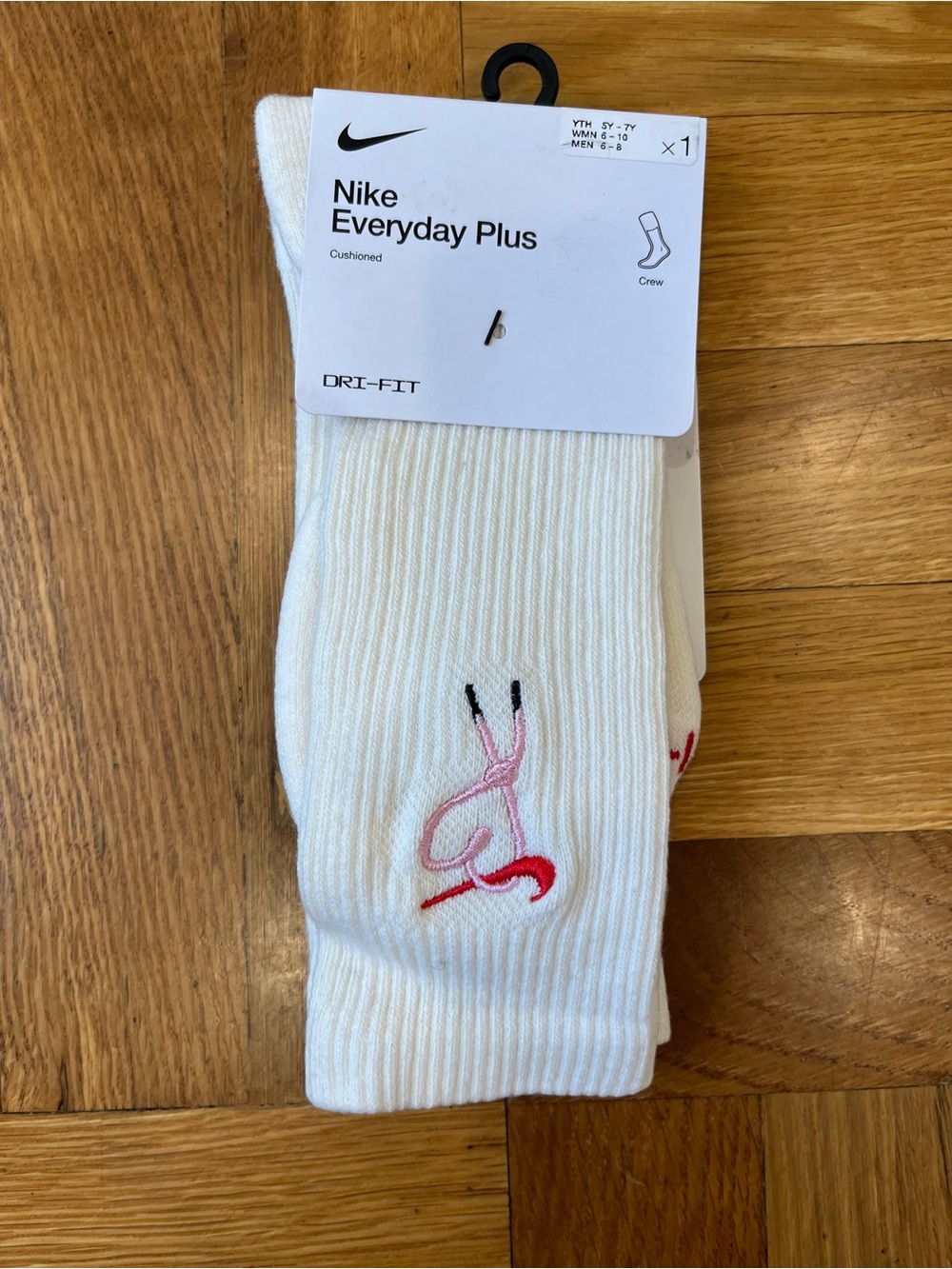 Nike White Crew Socks with Pink and Red Swoosh Accent